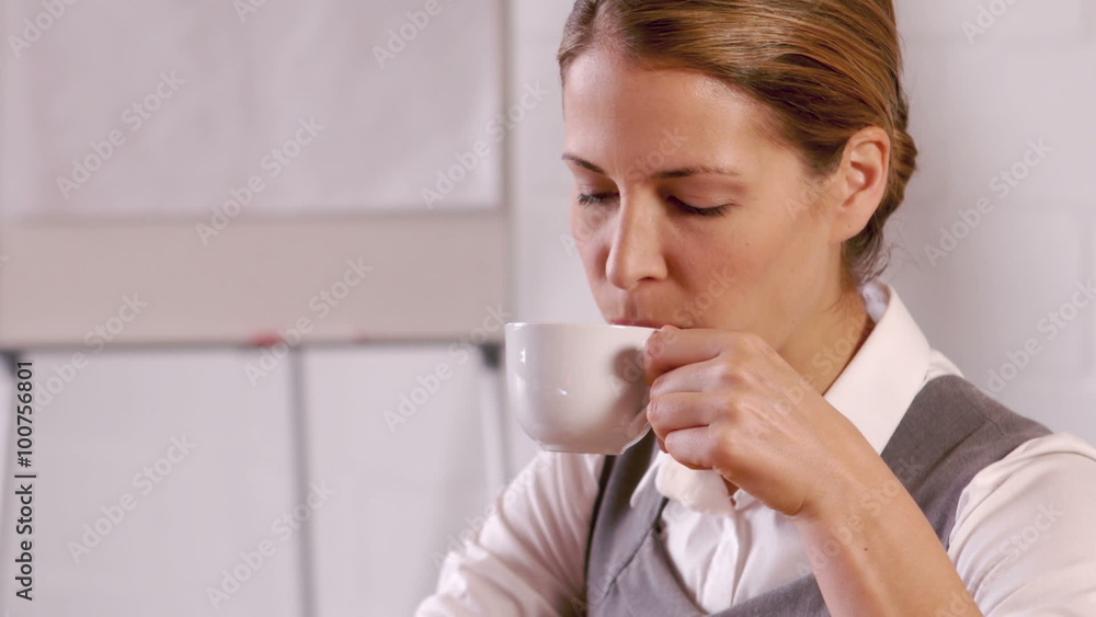 Elegant businesswoman drinking hot beverage Elegant businesswoman drinking hot beverage
