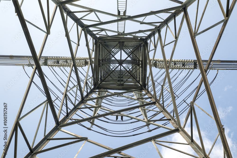 High voltage post electric power transmission tower and the blue sky background