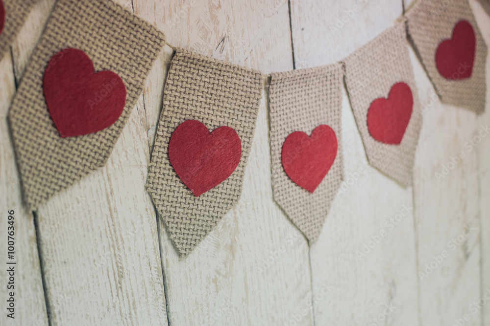 Fototapeta premium Valentine’s hearts on rustic wooden texture background 