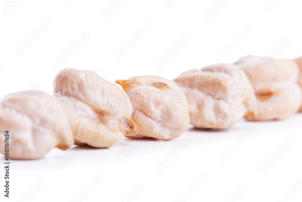 Align raw dry chickpeas on white background Align raw dry chickpeas on white background