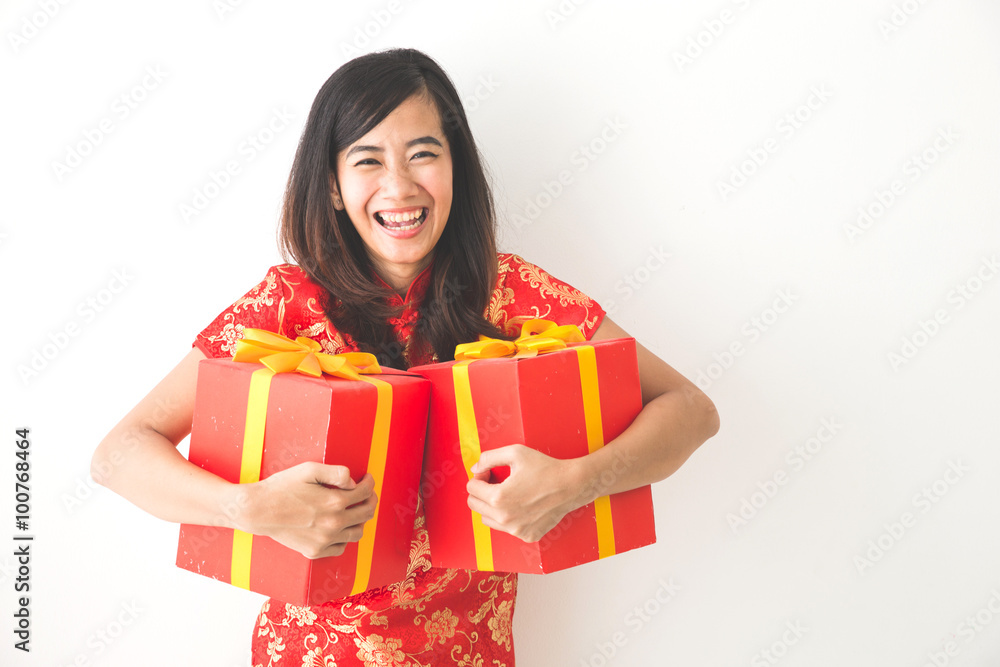 happy asian woman holding on gift box while celebrating chinese happy asian woman holding on gift box while celebrating chinese
