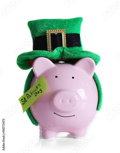 Piggy bank with St. Patrick hat, isolated on white