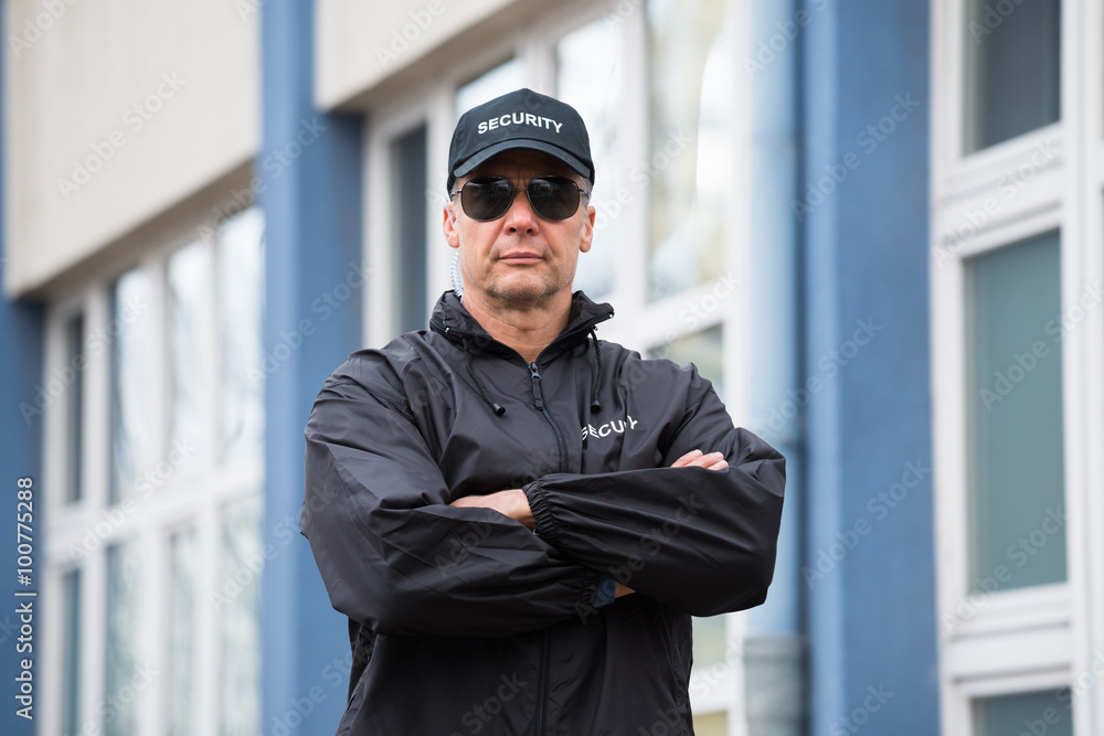 Security Guard Standing Arms Crossed Outside Building Security Guard Standing Arms Crossed Outside Building