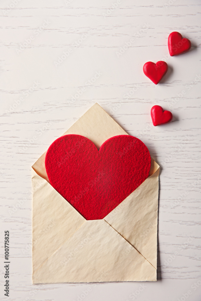 Blank open envelope with hearts on wooden background Blank open envelope with hearts on wooden background