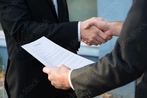 Businessman Shaking Hands With Partner photo