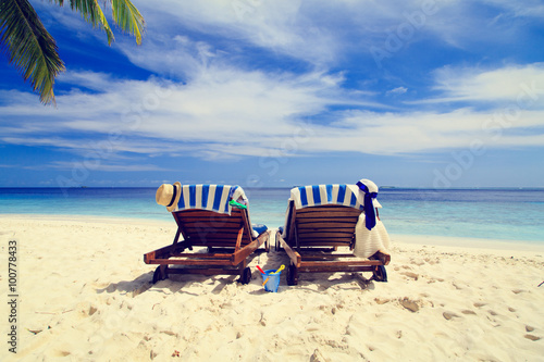 Fototapeta Naklejka Na Ścianę i Meble -  Two chairs on the tropical beach