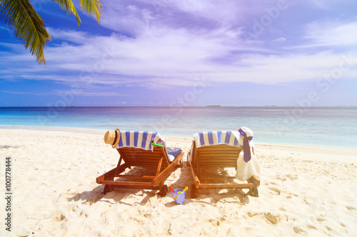Fototapeta Naklejka Na Ścianę i Meble -  Two chairs on the tropical beach