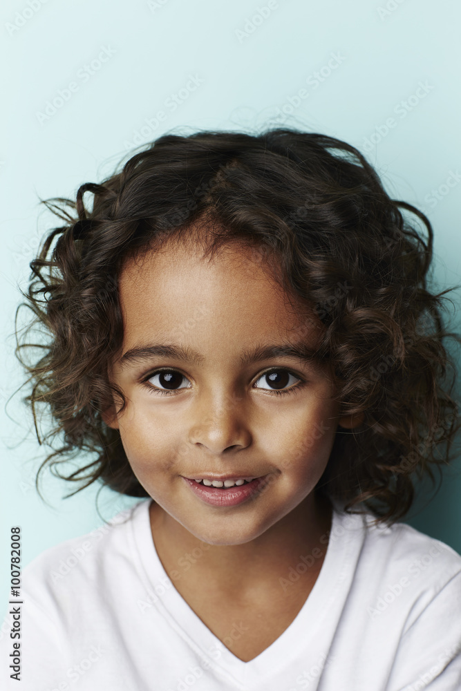 Smiling cool kid on blue background, portrait Smiling cool kid on blue background, portrait