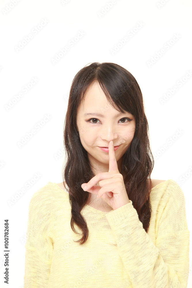 young Japanese woman whith silence gestures young Japanese woman whith silence gestures