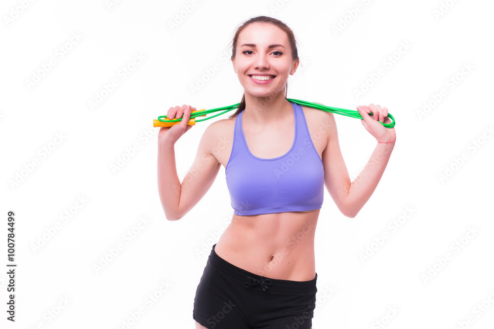 Young fitness woman with healthy sporty figure with skipping rope Young fitness woman with healthy sporty figure with skipping rope