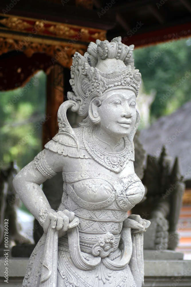 Balinese white sandstone statue of woman in temple