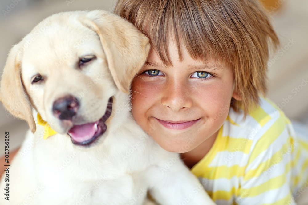 Happy kid with a dog at home Happy kid with a dog at home