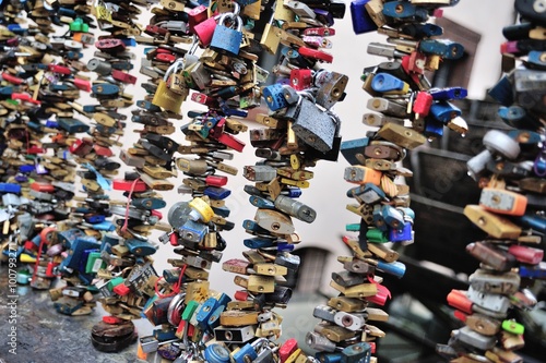 Dozens of love padlocks locked on the Prague bridge