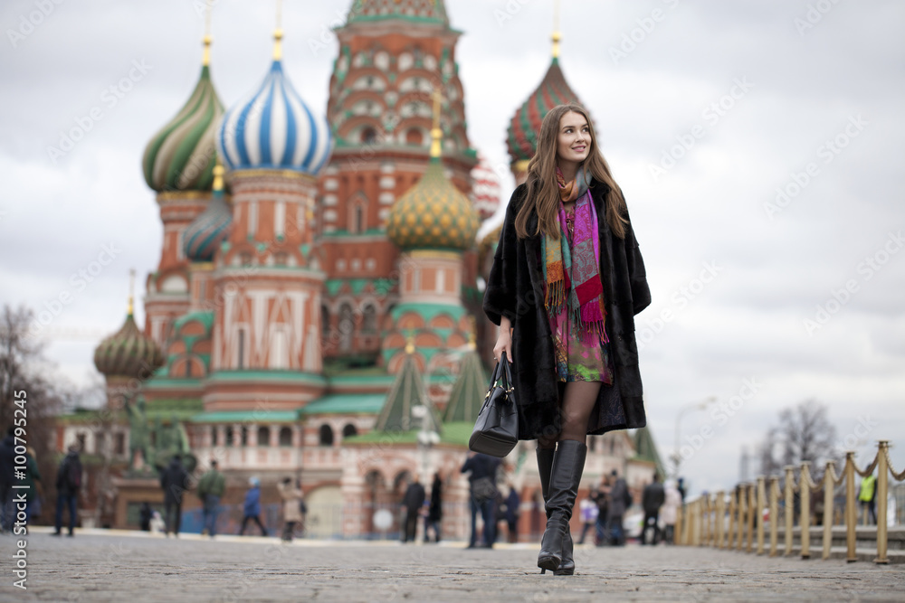Young woman in a mink coat on the Red Square in Moscow Young woman in a mink coat on the Red Square in Moscow