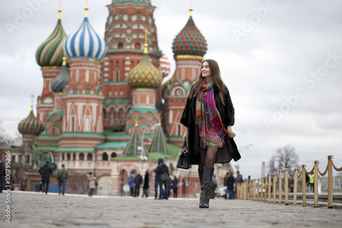 Young woman in a mink coat on the Red Square in Moscow
