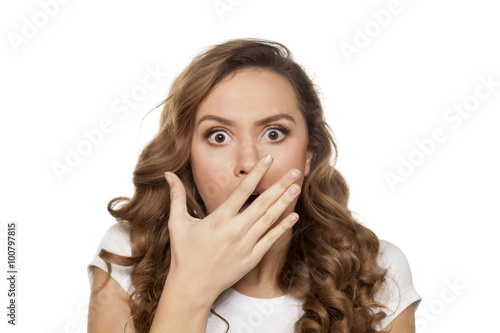 beautiful shocked girl on a white background