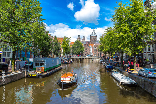 Photography Canal and St. Nicolas Church in Amsterdam