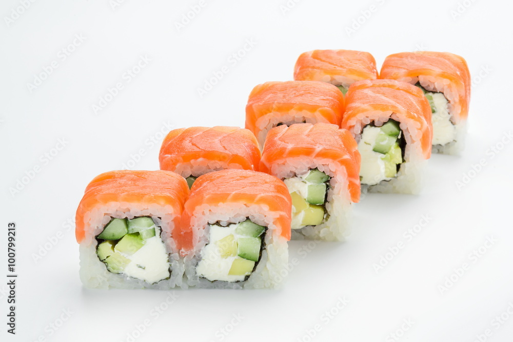 Sushi rolls with salmon, avocado, philadelphia and cucumber isolated on white background Sushi rolls with salmon, avocado, philadelphia and cucumber isolated on white background