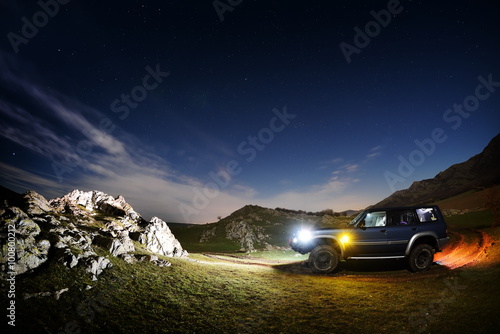 Night landscape on field and terrain car