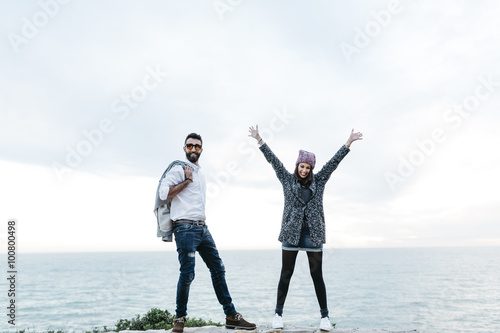 Young couple having fun near the sea