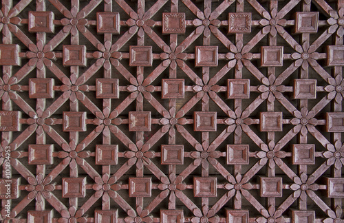 delicate carved wooden window lattice