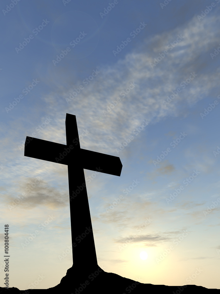 Black cross on mountain at sunset