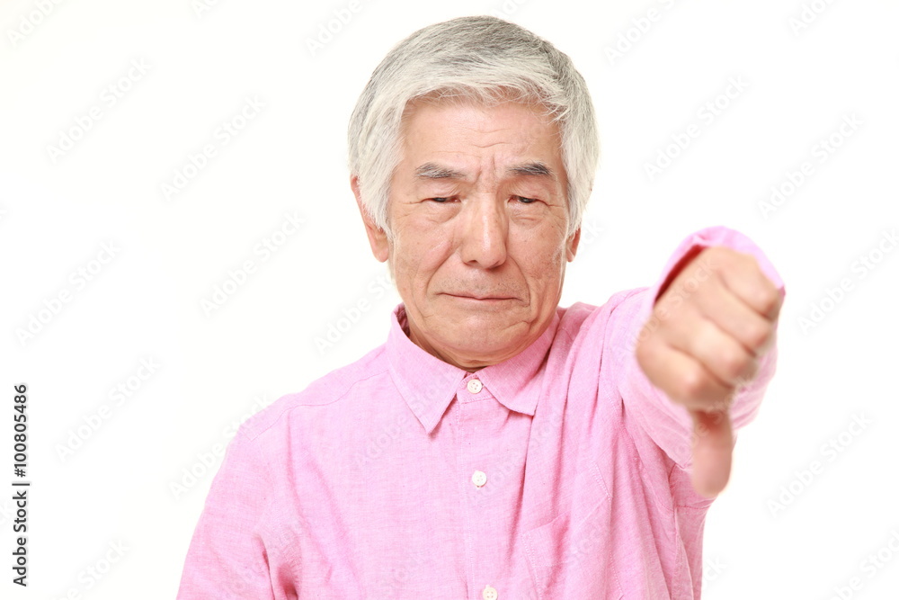 senior Japanese man with thumbs down gesture senior Japanese man with thumbs down gesture