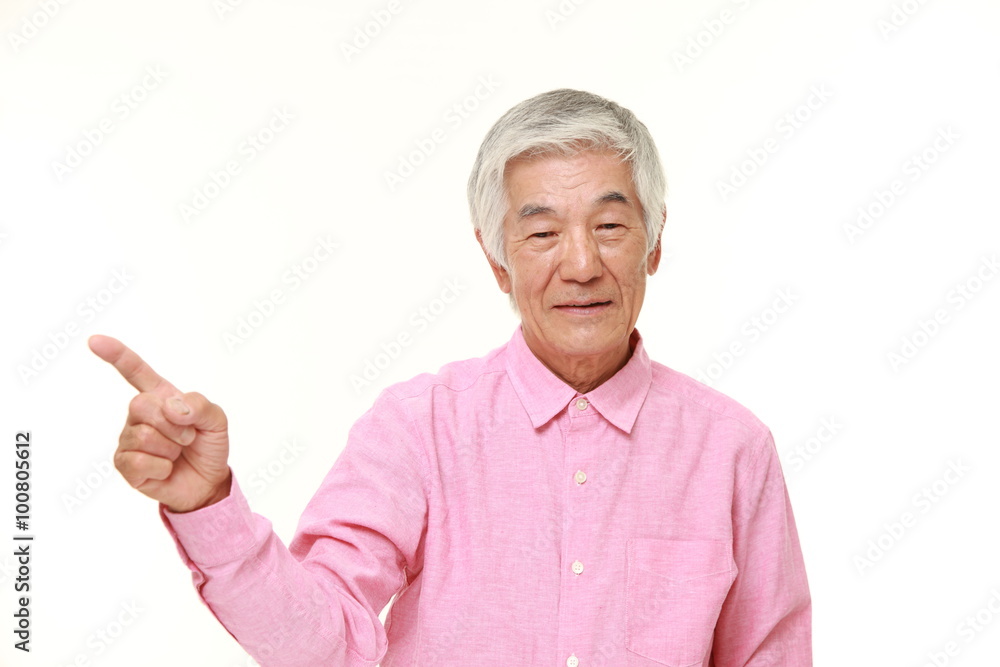 senior Japanese man presenting and showing something senior Japanese man presenting and showing something