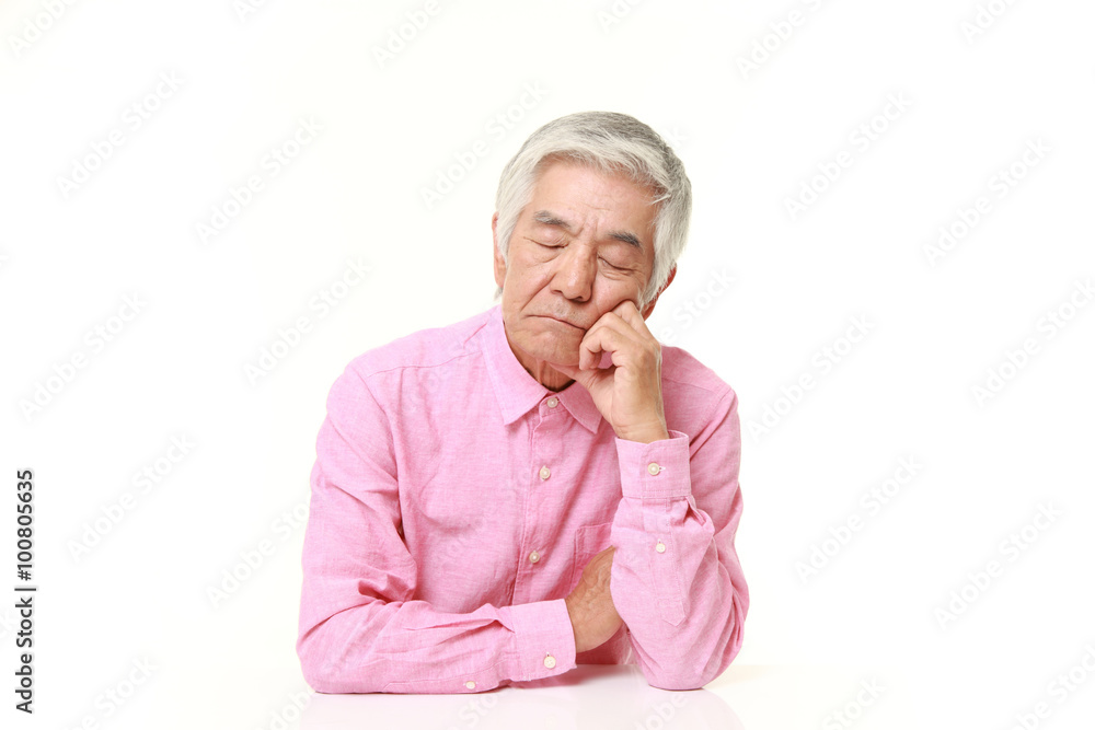 senior Japanese man sleeping on the table senior Japanese man sleeping on the table