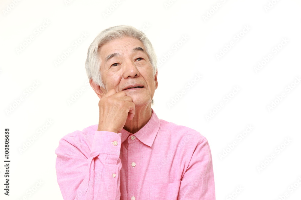 senior Japanese man dreaming at his future senior Japanese man dreaming at his future