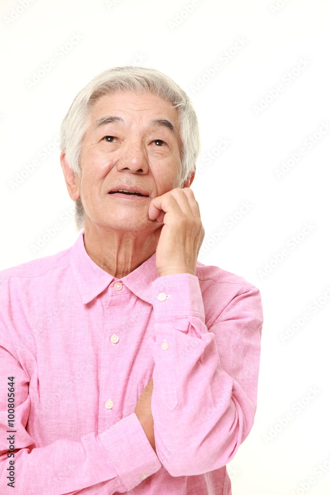 senior Japanese man dreaming at his future senior Japanese man dreaming at his future
