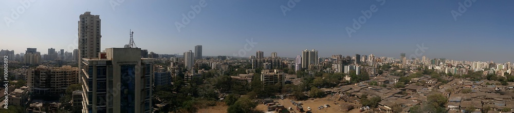 Panoramic shot of cityscape against clear blue sky Panoramic shot of cityscape against clear blue sky