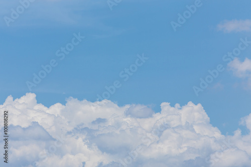 fluffy cloud on clear blue sky background