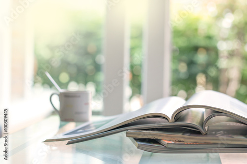 selective focus of stacking magazine place on table in living ro photo