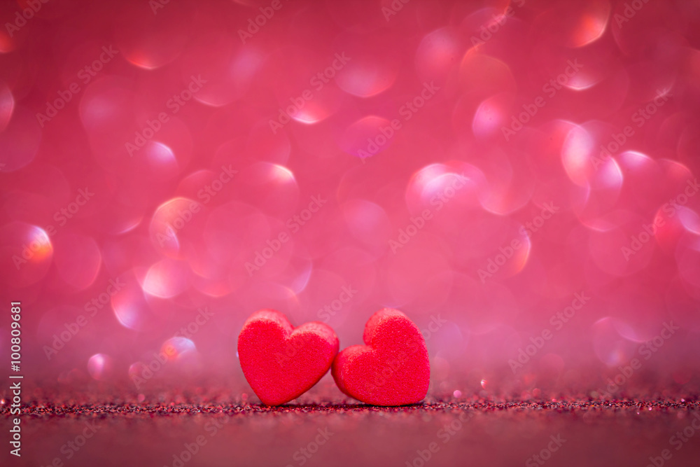 red Heart shapes on abstract light background in love concept