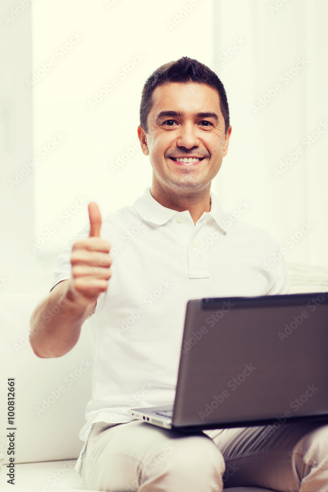 happy man working with laptop computer at home happy man working with laptop computer at home