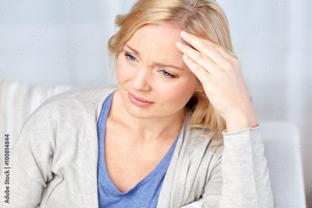woman suffering from headache at home woman suffering from headache at home