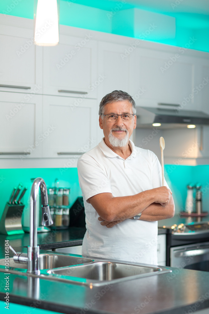 Senior man standing in his renovated, modern kitchen, Senior man standing in his renovated, modern kitchen,