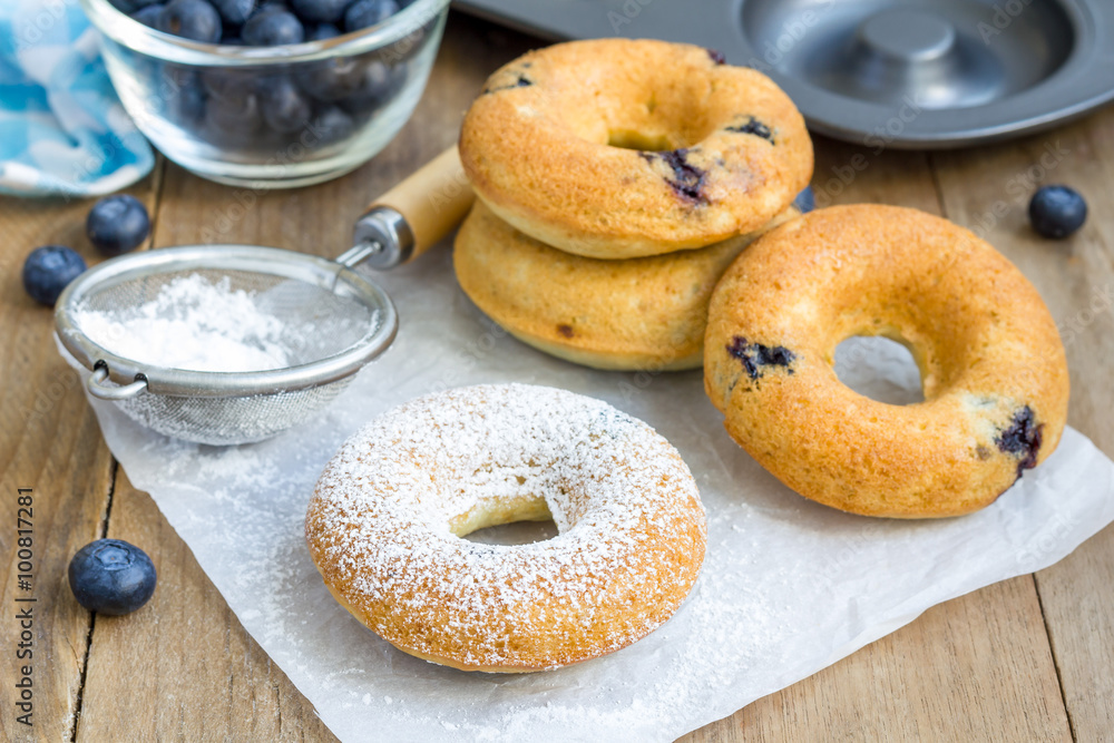 Freshly baked doughnuts with blueberries for breakfast