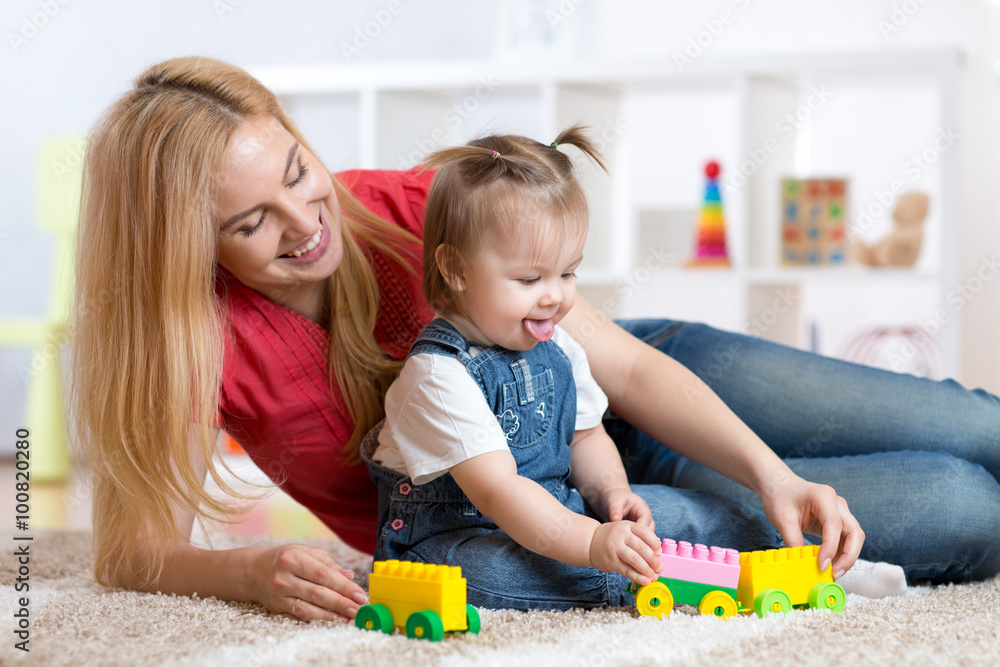 mother and child girl playing together indoor mother and child girl playing together indoor