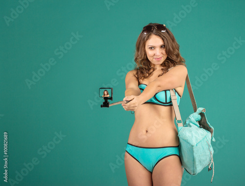 Pretty tourist girl with action camera © PaulShlykov