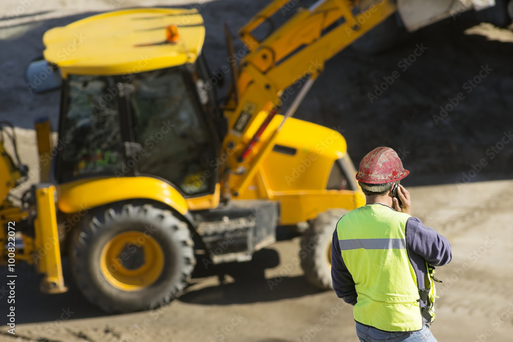 engineer foreman in highway construction site with excavators selective focus 