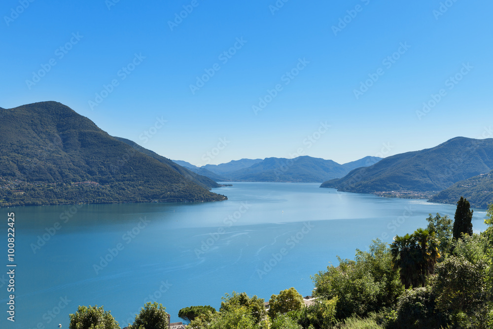 Panoramic of Lake Maggiore, part of Italian Switzerland. A very bland sunny day in pina estat with an intense blue lake. Panoramic of Lake Maggiore, part of Italian Switzerland. A very bland sunny day in pina estat with an intense blue lake.