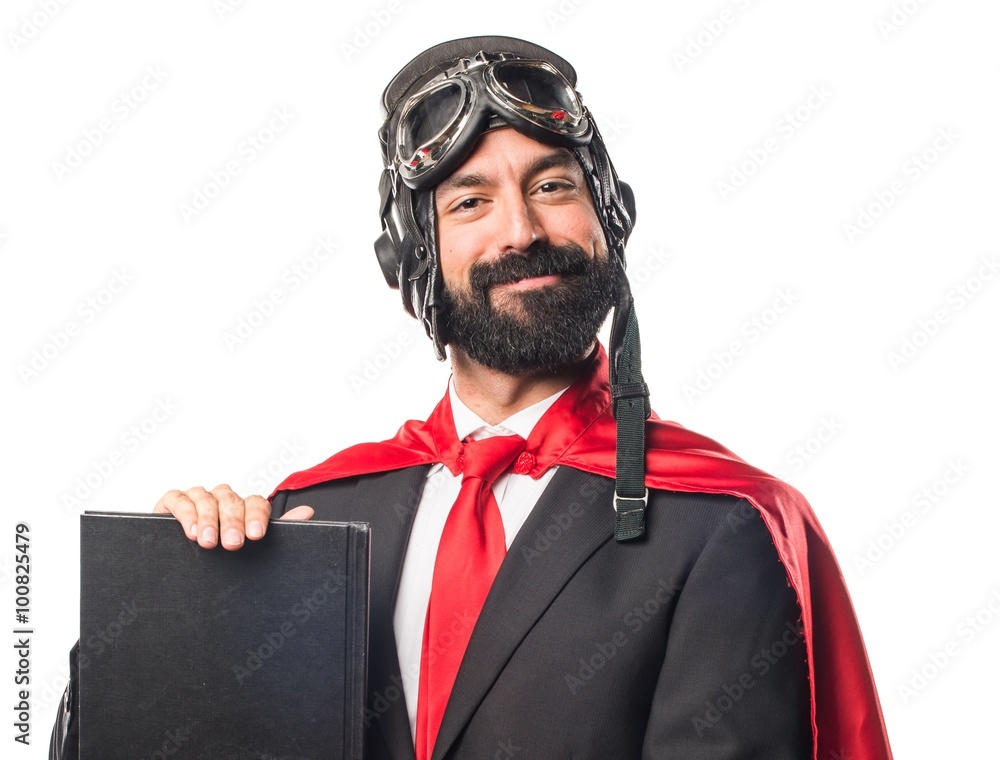 Super hero businessman reading book Super hero businessman reading book