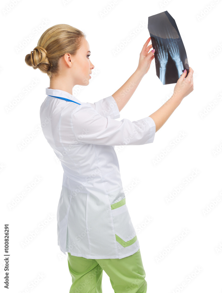 Young doctor in uniform with x-ray