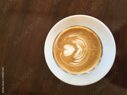 A cup of coffee latte with heart pattern