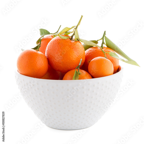 Tangerines on ceramic white bowl