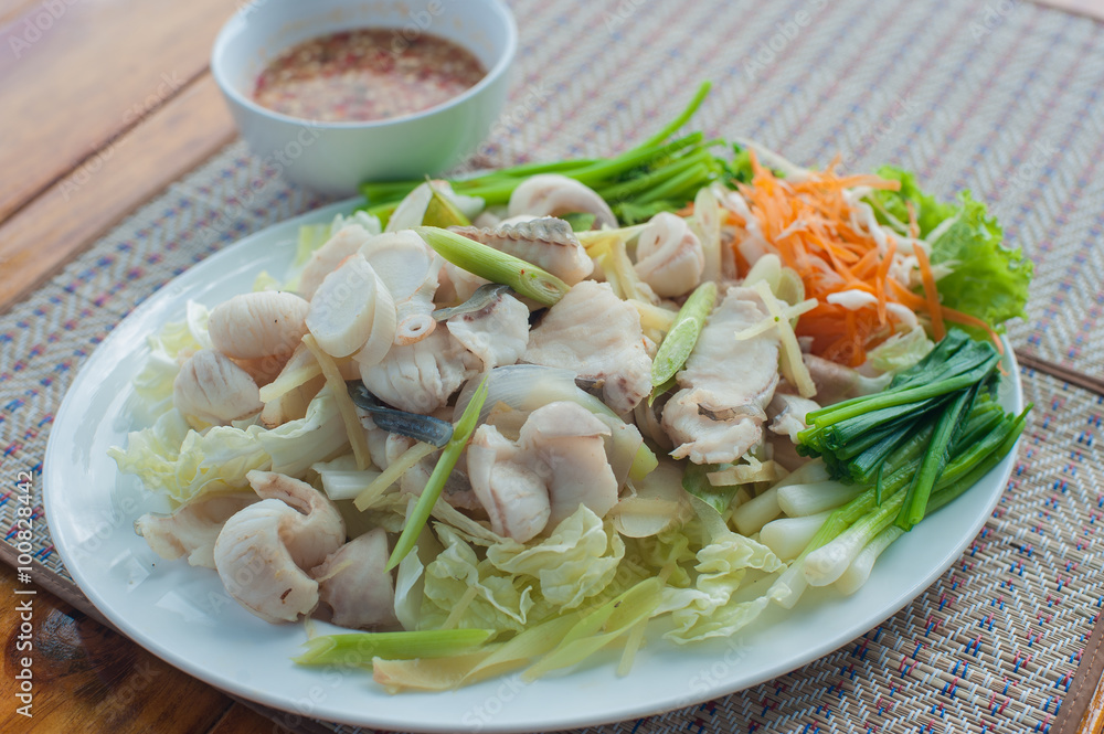 Boiled fish with Thai Spicy Sauce place on plate Boiled fish with Thai Spicy Sauce place on plate
