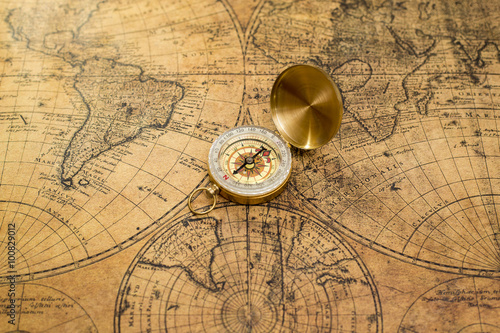 old compass on vintage map