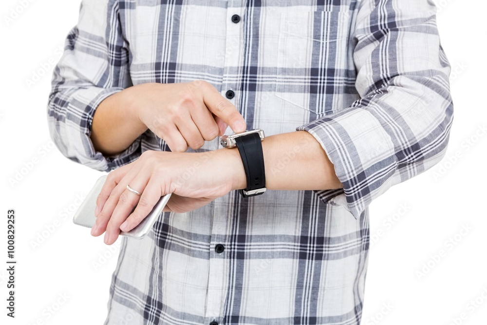 Man using his smartwatch Man using his smartwatch